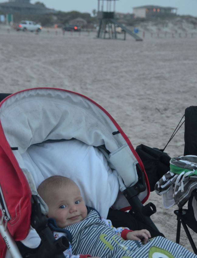 Baby In Pram On Beach Holiday